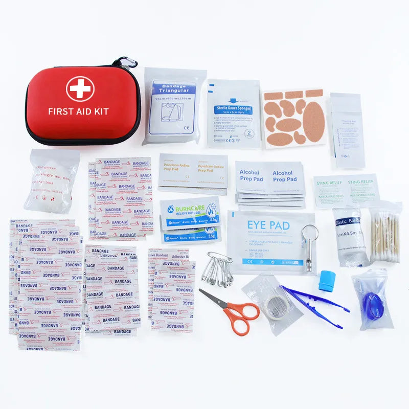 First aid kit with various components on a white background
